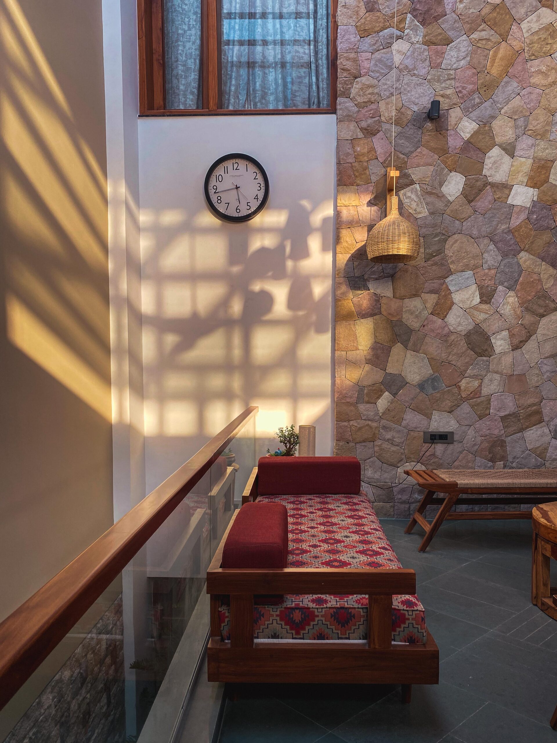 A seating space where soft daylight and layered natural materials come together in a calm, cohesive spatial experience.