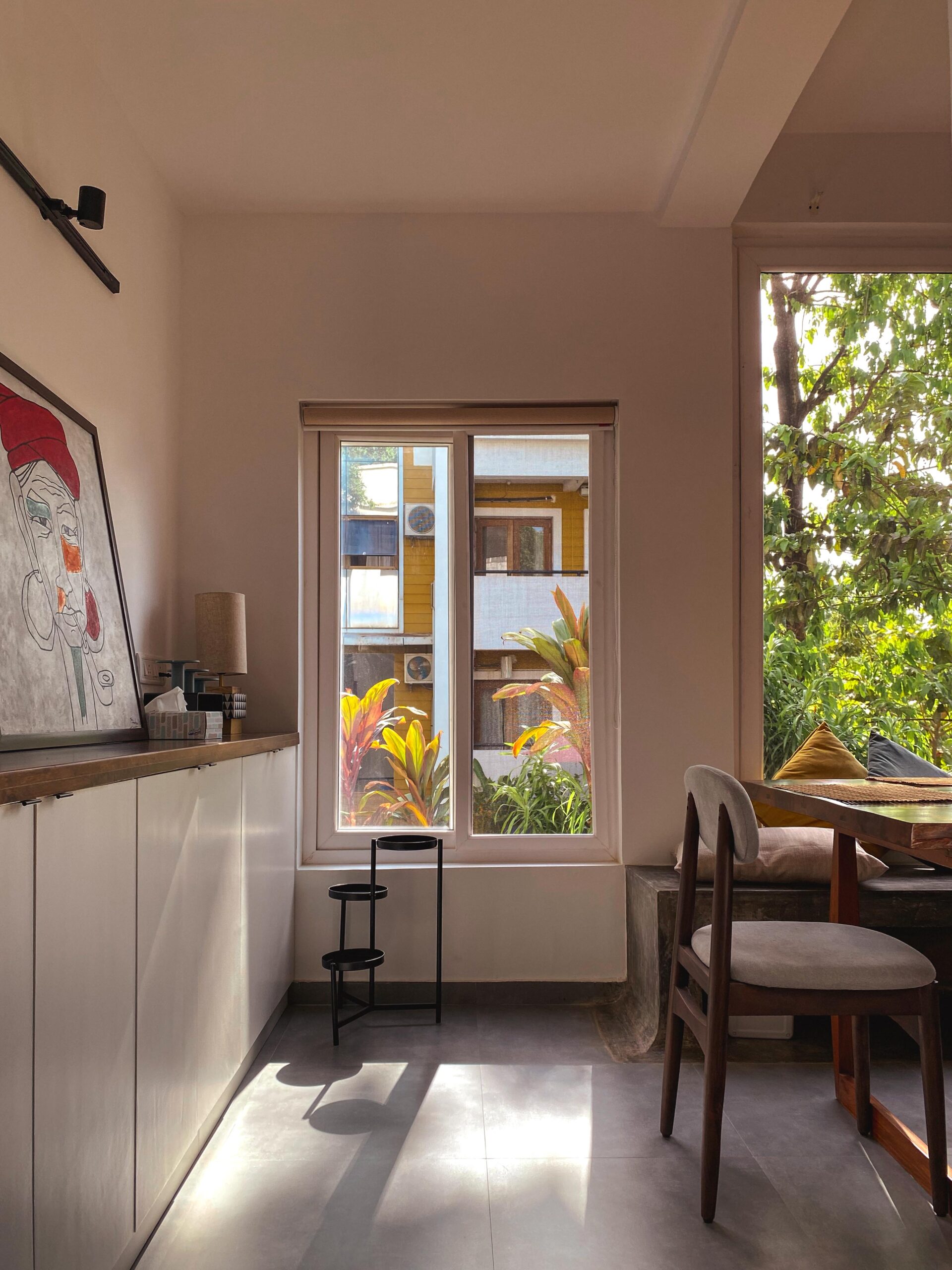 A curated corner: The dining area features custom built-in seating and a sleek sideboard, providing the perfect stage for statement artwork.