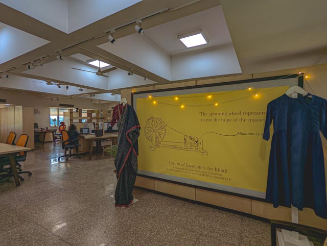 Collaborative Design Studio: The open-plan layout seamlessly blends garment display areas with functional workstations, fostering an environment where traditional craftsmanship meets contemporary design research.